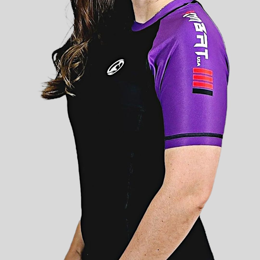 KOMBAT WOMAN H/S PRO RASH GUARD BLACK & PURPLE
